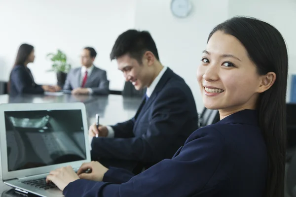 Businesswoman Looking Over Her Shoulder at the Camera — Stock Photo, Image