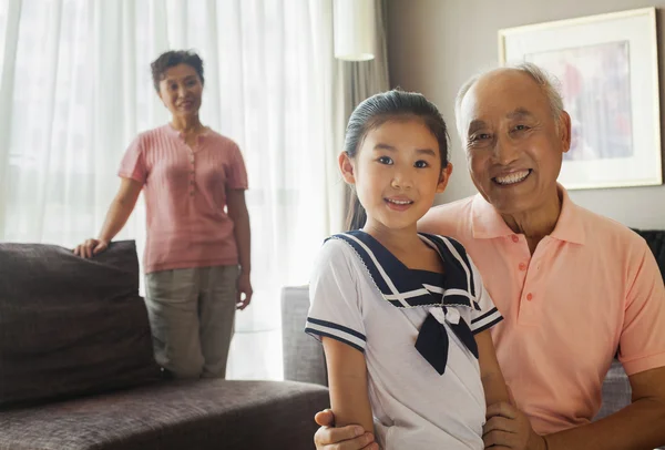 Grandfather holding his granddaughter — Stock Photo, Image