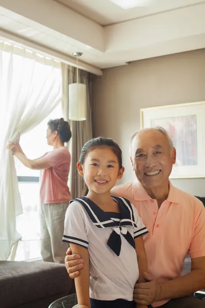 Grandfather holding his granddaughter — Stock Photo, Image