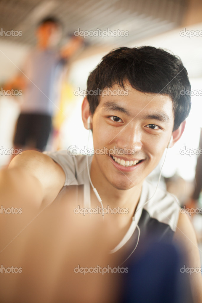 Young man exercising in the gym