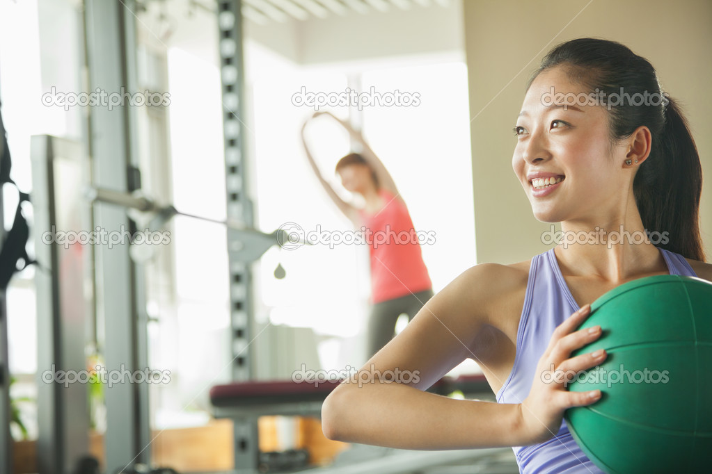 Young woman exercising in the gym