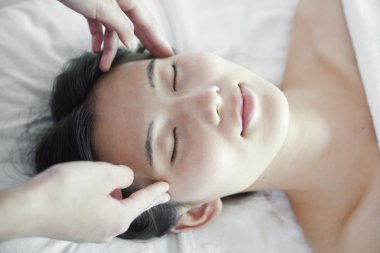 Woman Receiving Head Massage clipart