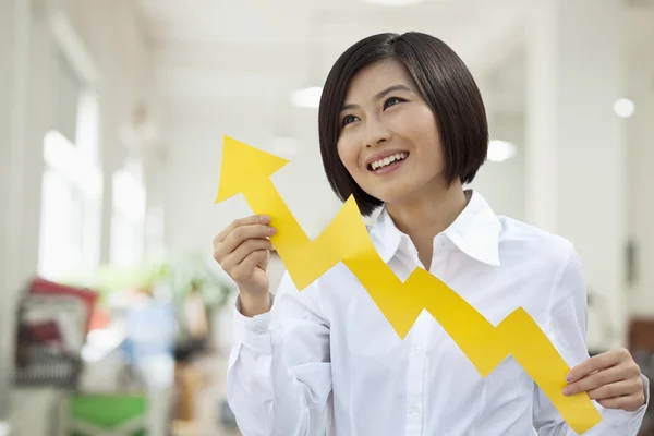 Woman Holding Arrow Sign Paper Cut — Stock Photo, Image