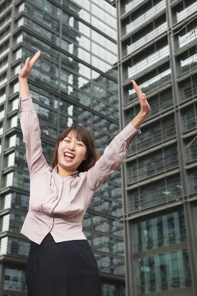 Businesswoman with arms outstretched — Stock Photo, Image