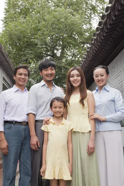 Three Generation Family in a Courtyard — Stock Photo, Image