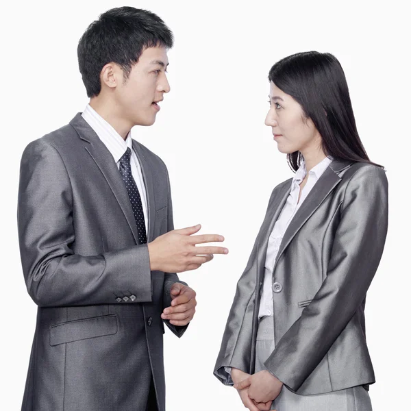 Businessman talking to businesswoman — Stock Photo, Image