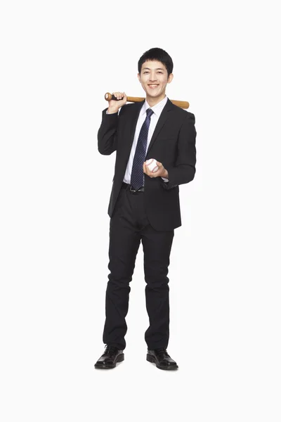 Businessman with bat and baseball — Stock Photo, Image