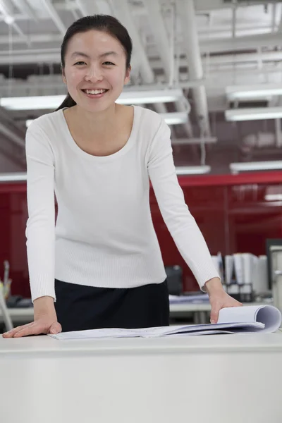 Businesswoman analyzing architecture project — Stock Photo, Image