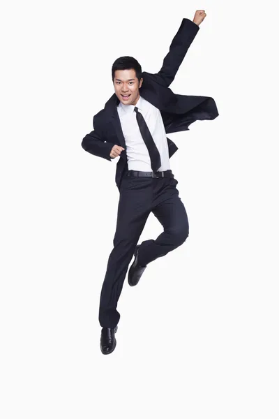 Young businessman jumping — Stock Photo, Image