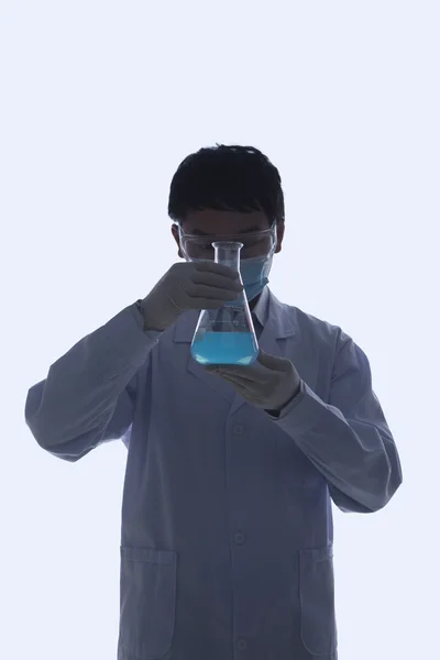 Scientist Looking at Beaker — Stock Photo, Image