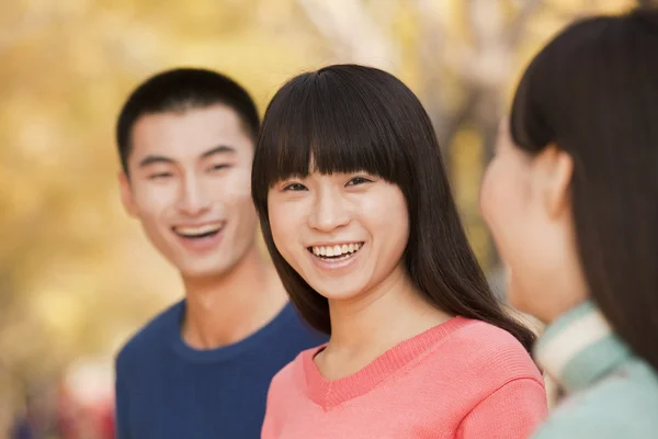 People enjoying a park in autumn — Stock Photo, Image