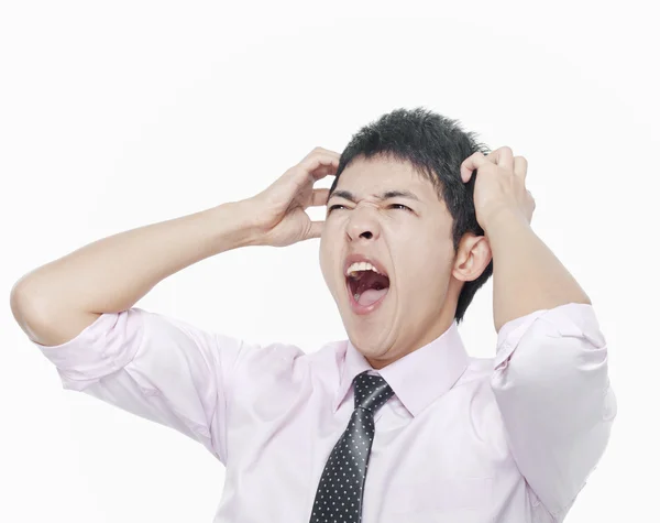 Man with hands on head screaming — Stock Photo, Image