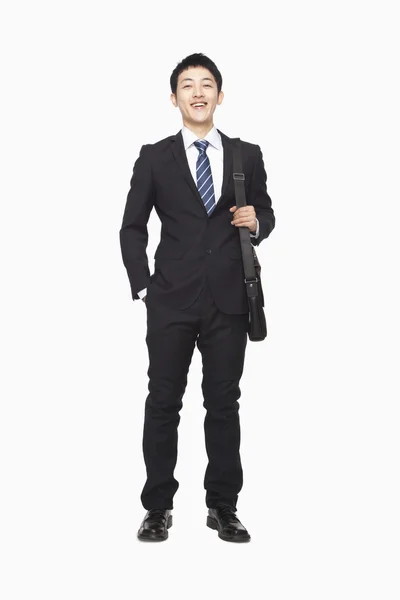 Businessman standing with briefcase — Stock Photo, Image