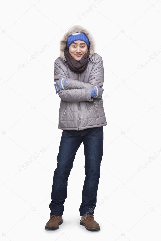 Man in winter clothes freezing