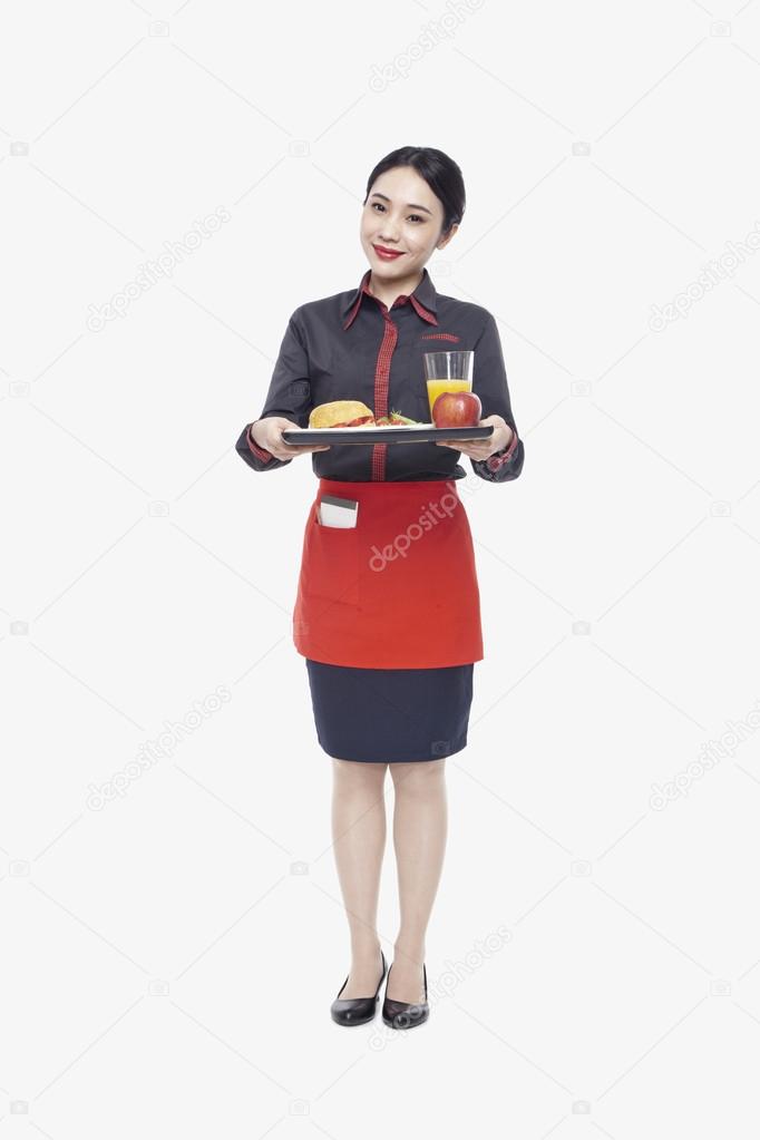 Waitress carrying tray with food