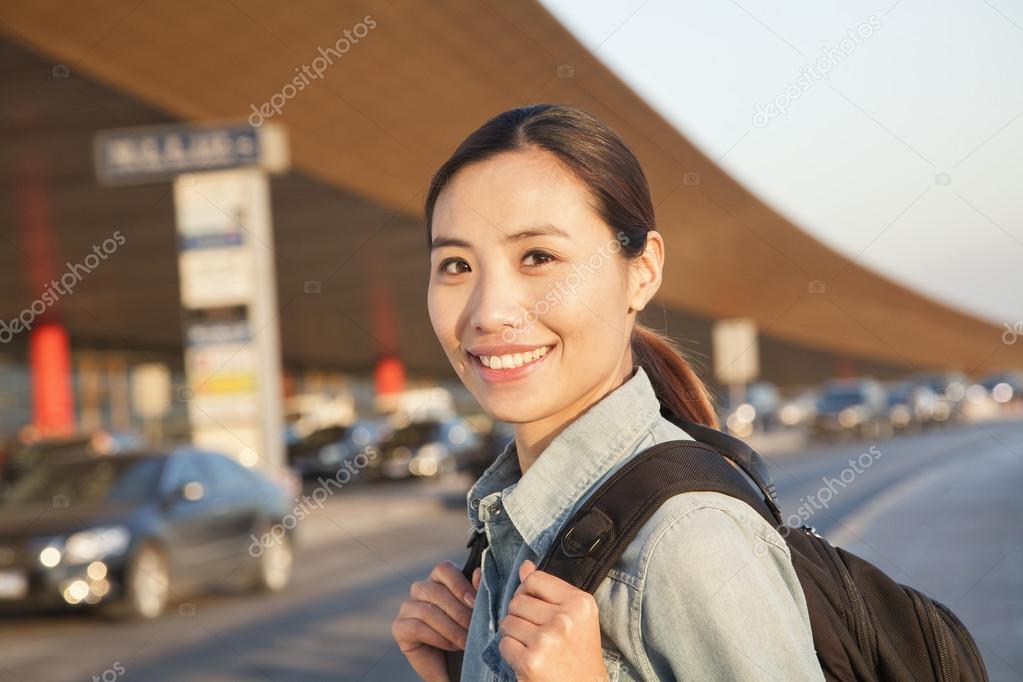 Traveler portrait outside of airport