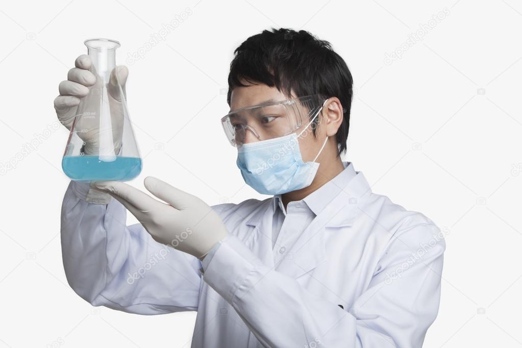 Scientist Looking at Beaker