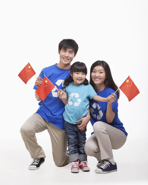 Family waving Chinese flags — Stock Photo, Image
