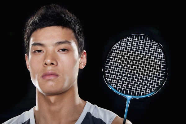 Man with badminton racket — Stock Photo, Image