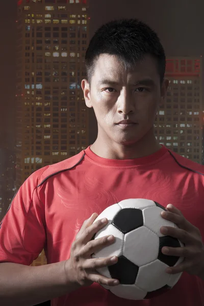 Footballer holding ball — Stock Photo, Image