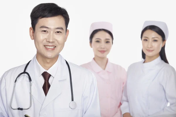 Doctor, young nurses — Stock Photo, Image