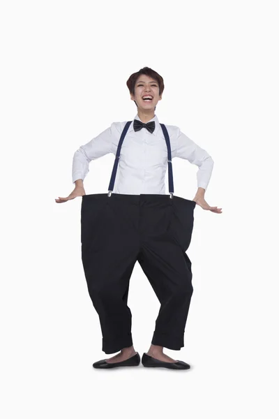 Girl in oversized pants — Stock Photo, Image