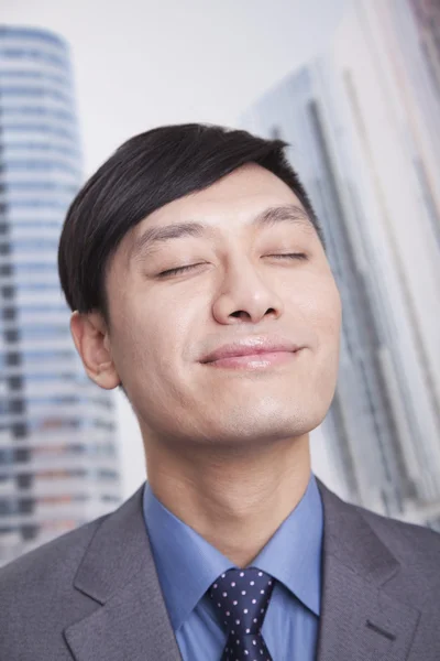 Businessman with eyes closed — Stock Photo, Image