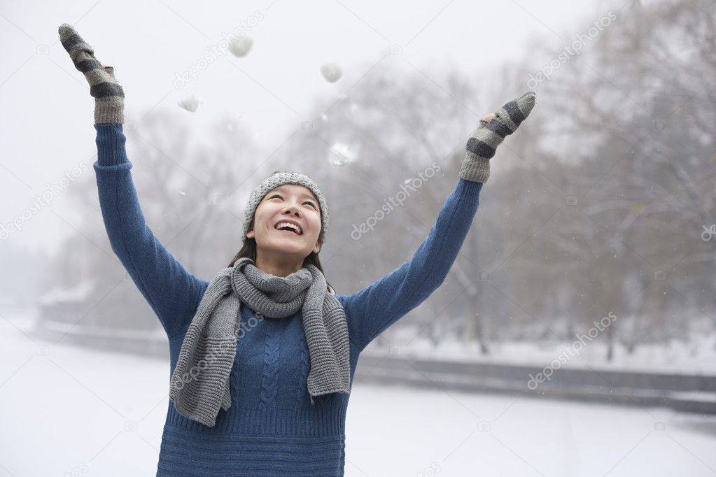 Woman Playing in the Snow