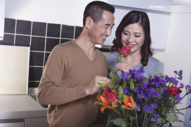 Mature Couple with Bouquet of Flowers clipart