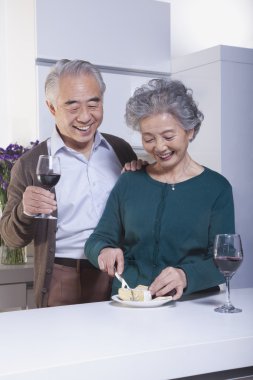 Senior Couple Drinking Wine and Cheese clipart