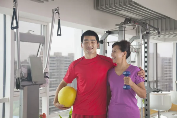 Woman with her trainer after working out — Stock Photo, Image