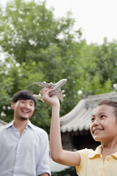 Girl Playing with Airplane — Stock Photo, Image