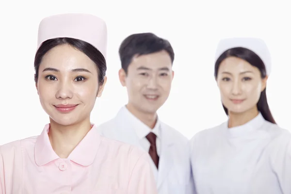 Nurse, doctor and nurse in the background — Stock Photo, Image