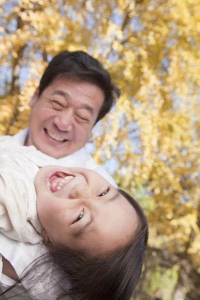 Grandfather and Granddaughter Playing in the Park — Stock Photo, Image