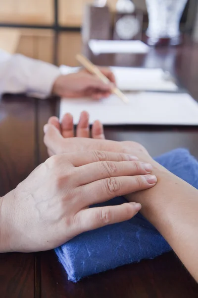Patient's Hand While Doctor Takes Pulse — Stock Photo, Image