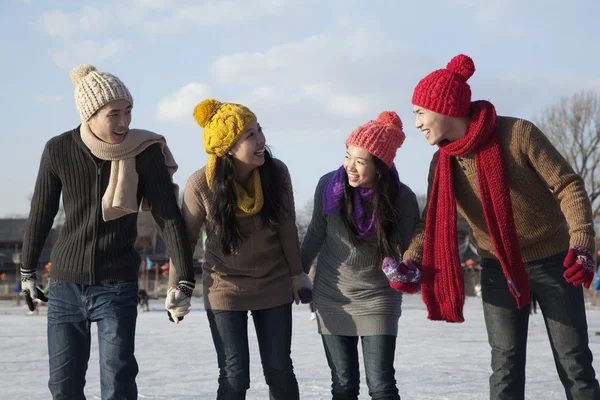 Friends on ice rink — Stock Photo, Image