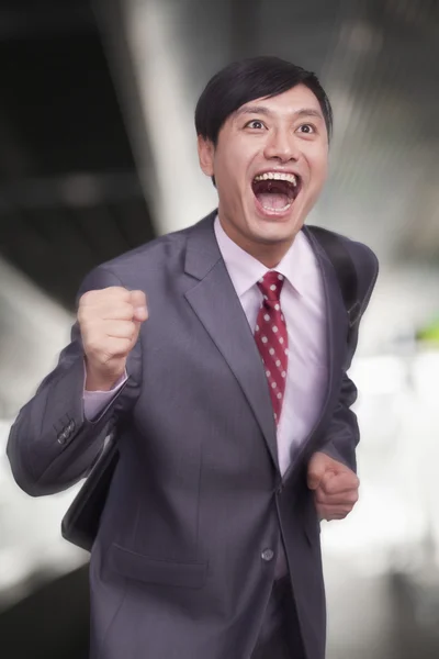 Young businessman running — Stock Photo, Image