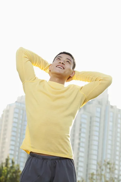 Athletic Man Standing in a Park — Stock Photo, Image