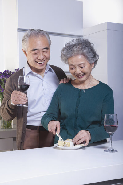 Senior Couple Drinking Wine and Cheese