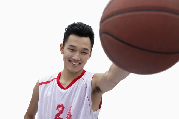 Basketball Player Holding Out Basketball — Stock Photo, Image