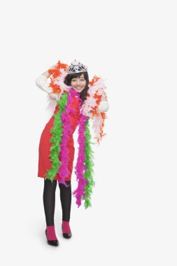 Girl wearing feather boas and tiara clipart