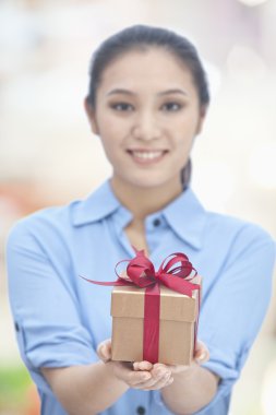 Woman Holding Gift Box clipart