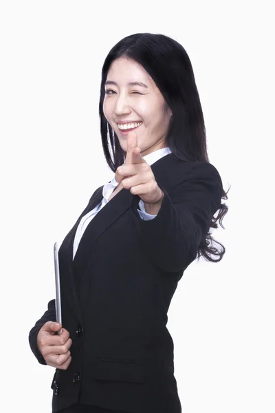 Businesswoman pointing finger like gun — Stock Photo, Image