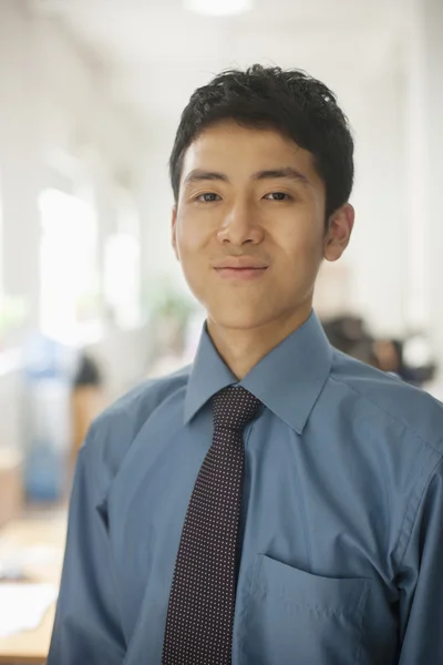 Man smiling in the office — Stock Photo, Image