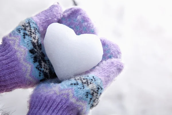 Snow Heart in Hands with Mittens — Stock Photo, Image