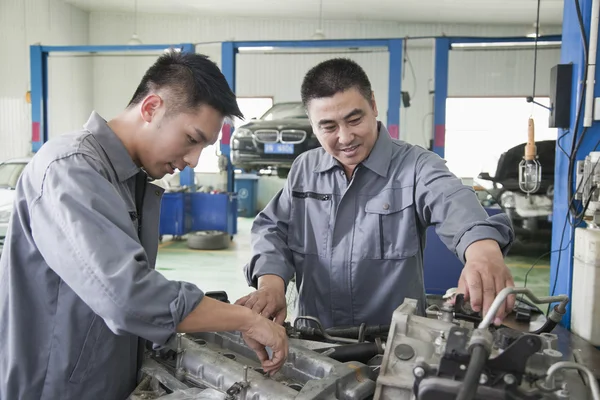 Two Mechanics Working on Car Engine — Stock Photo, Image