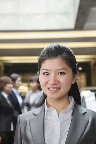 Businesswoman in parking garage — Stock Photo, Image