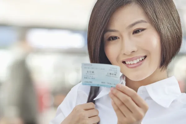 Woman Looking at a Train Ticket — Stock Photo, Image