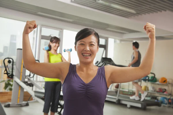 Mature woman after workout in the gym — Stock Photo, Image