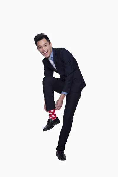 Podnikatel s červeným polka dot ponožky — Stock fotografie